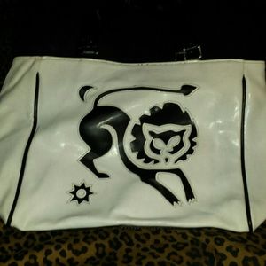 White leather purse with black outlining of a lion